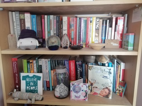 two of my bookshelves full of 'How-To' books and assorted keep-sakes such as crocheted toys, paperweights and cards